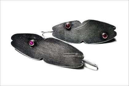 Parker.ovular shaped earrings with tube set stones