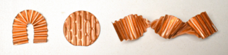 Three pieces of copper metal with different microfold pleats and cut, folded, or twisted into a different shape