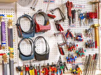 Metalwerx tool wall with sawblades, pliers, jewelry hammers, and more